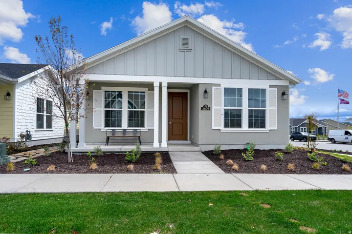 Contemporary exterior with board and batten siding and stucco accents
