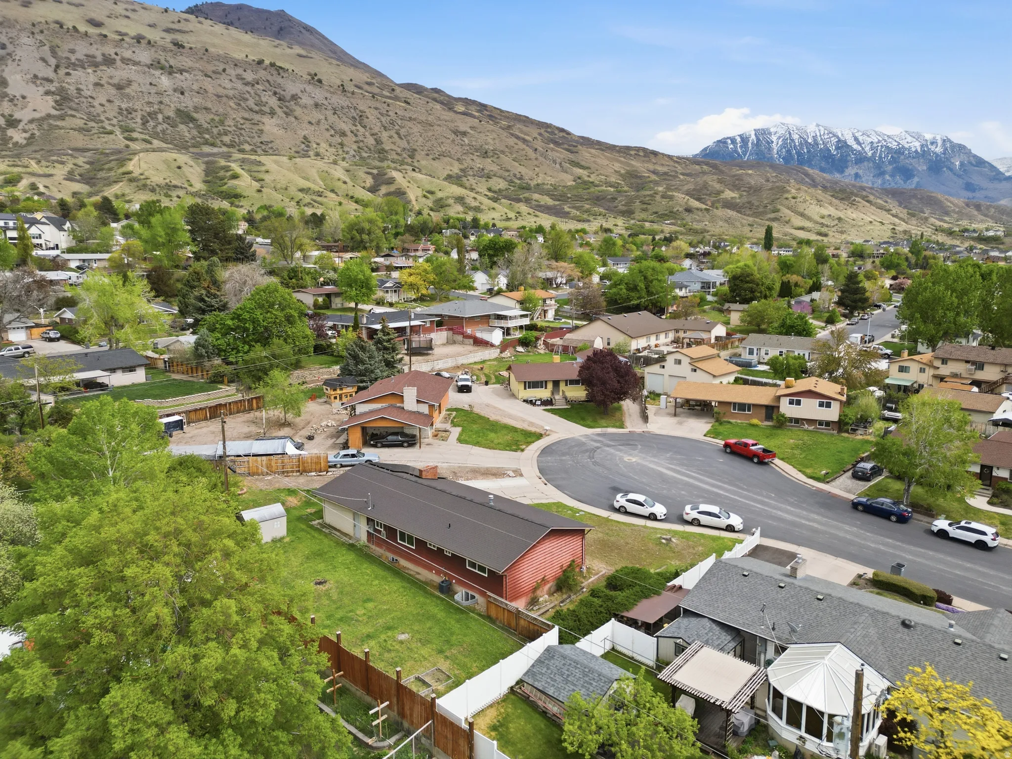 Aerial view of residential area featuring a mountainous background