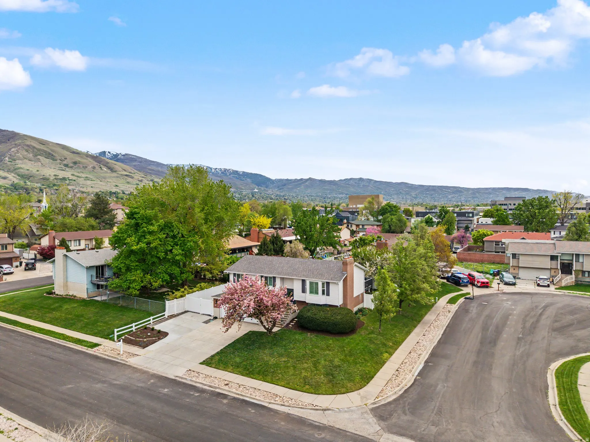 Aerial view of residential area with a mountainous background