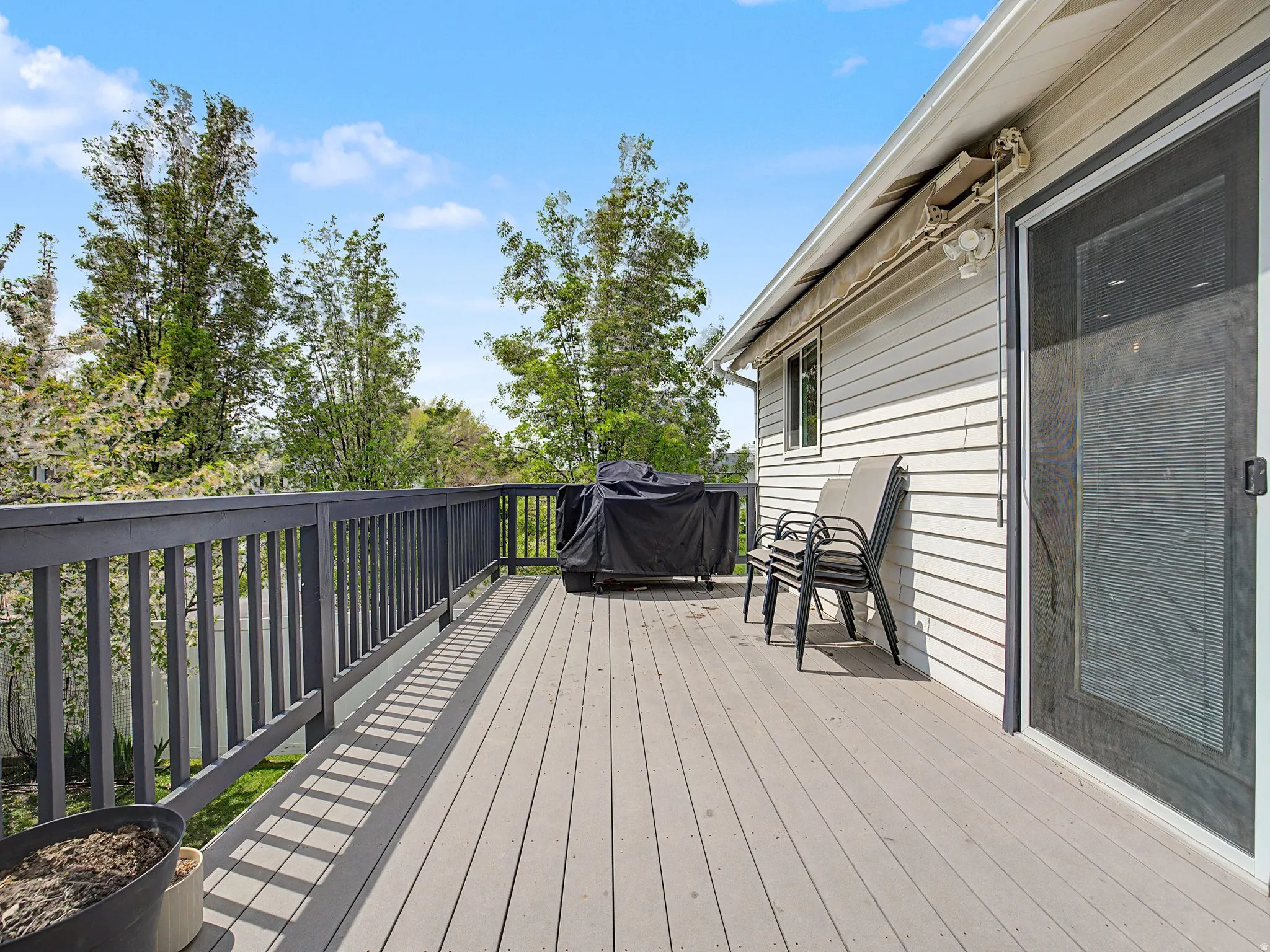 Wooden deck featuring grilling area