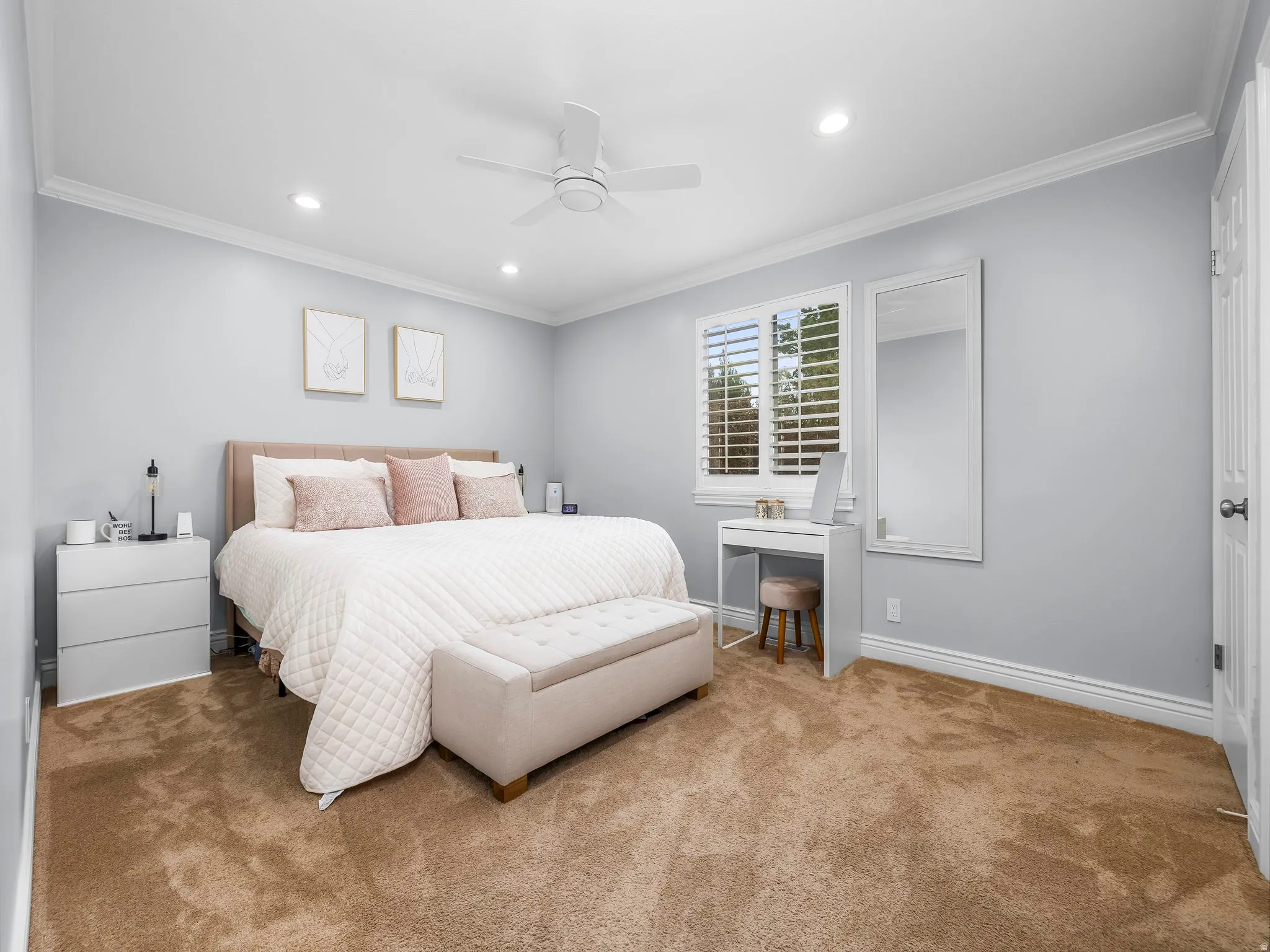 Carpeted bedroom with ornamental molding, recessed lighting, and ceiling fan
