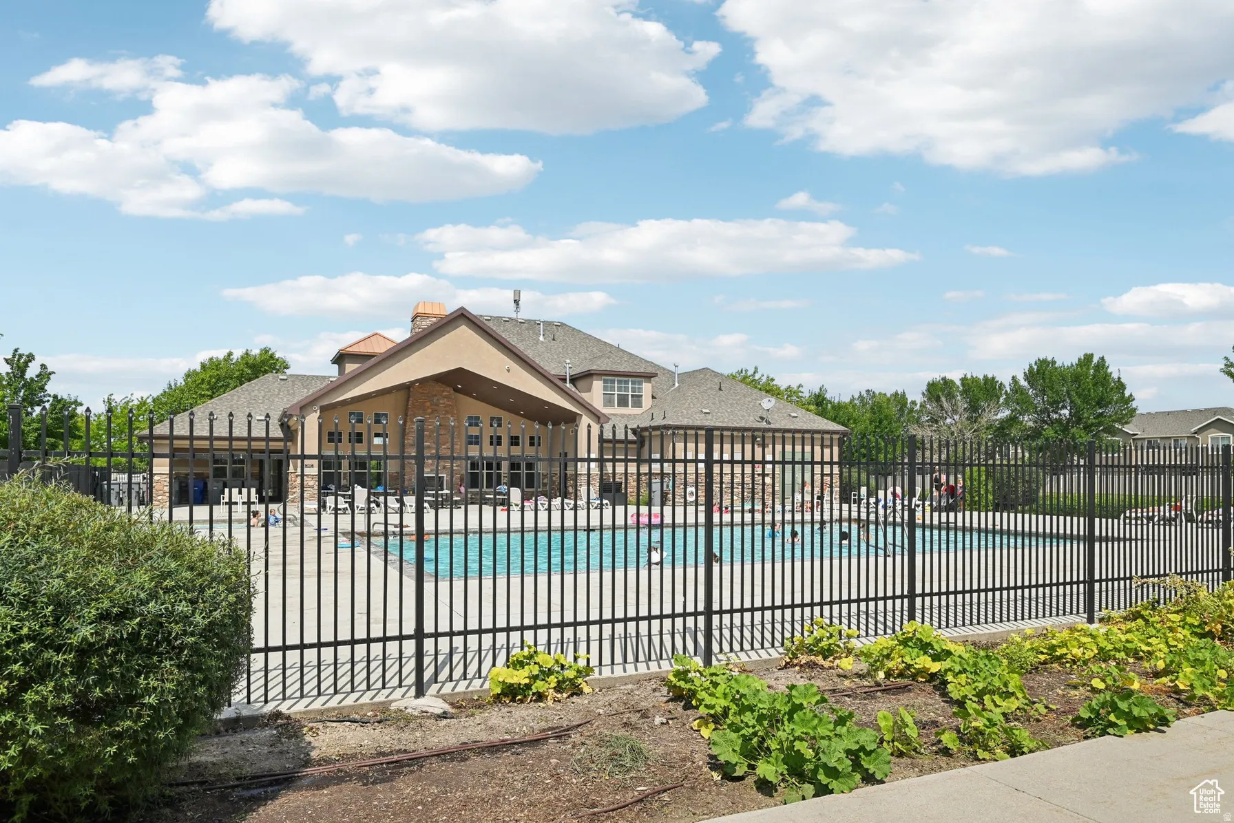 Community pool with a patio