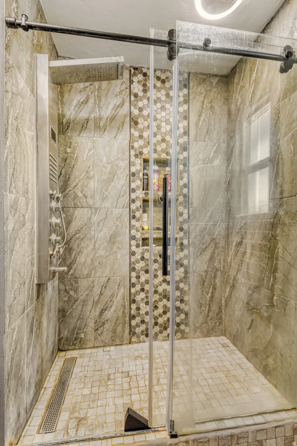 Full bath with a shower stall