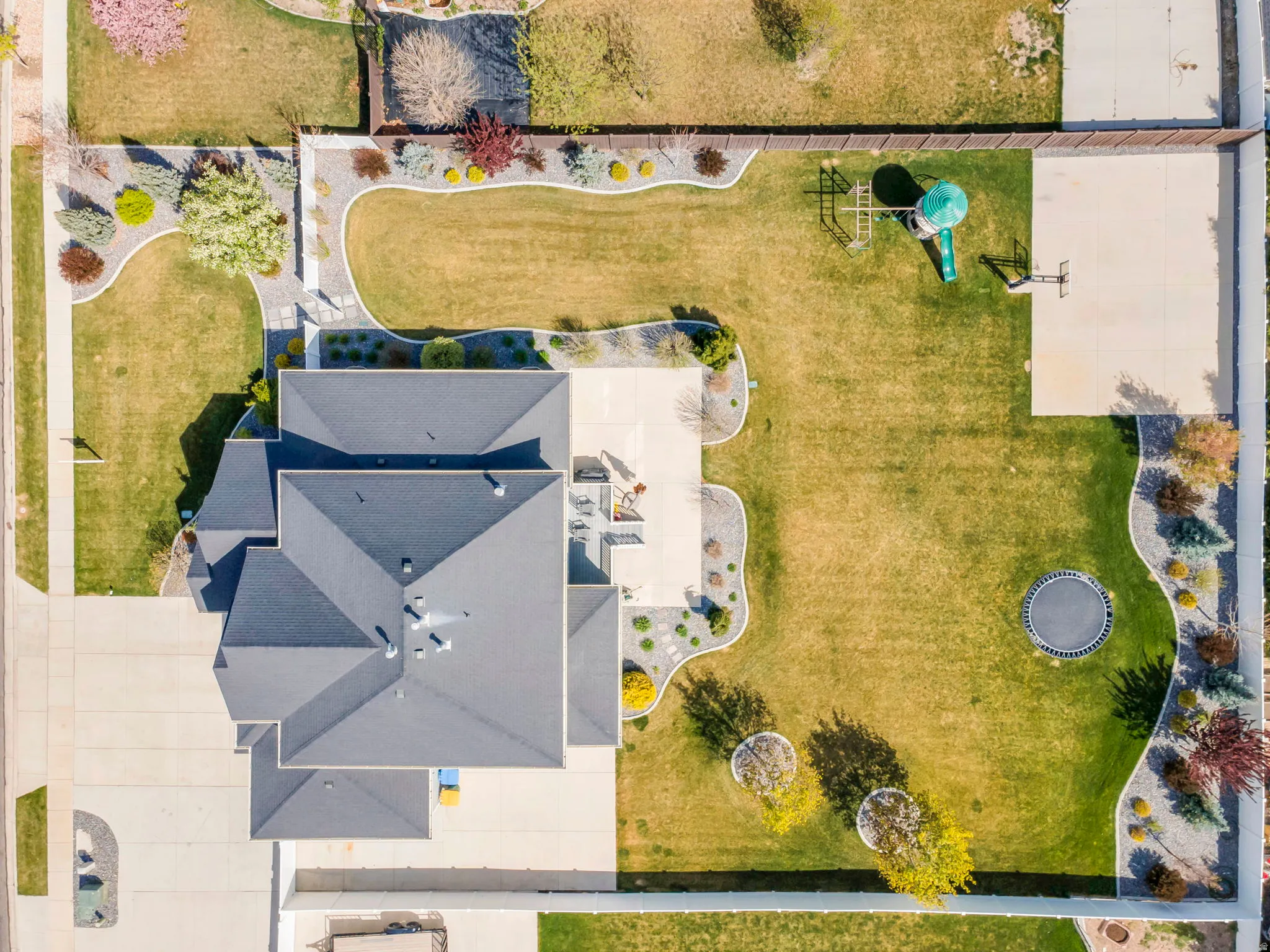 Bird's eye view! Well designed landscaping front and back!