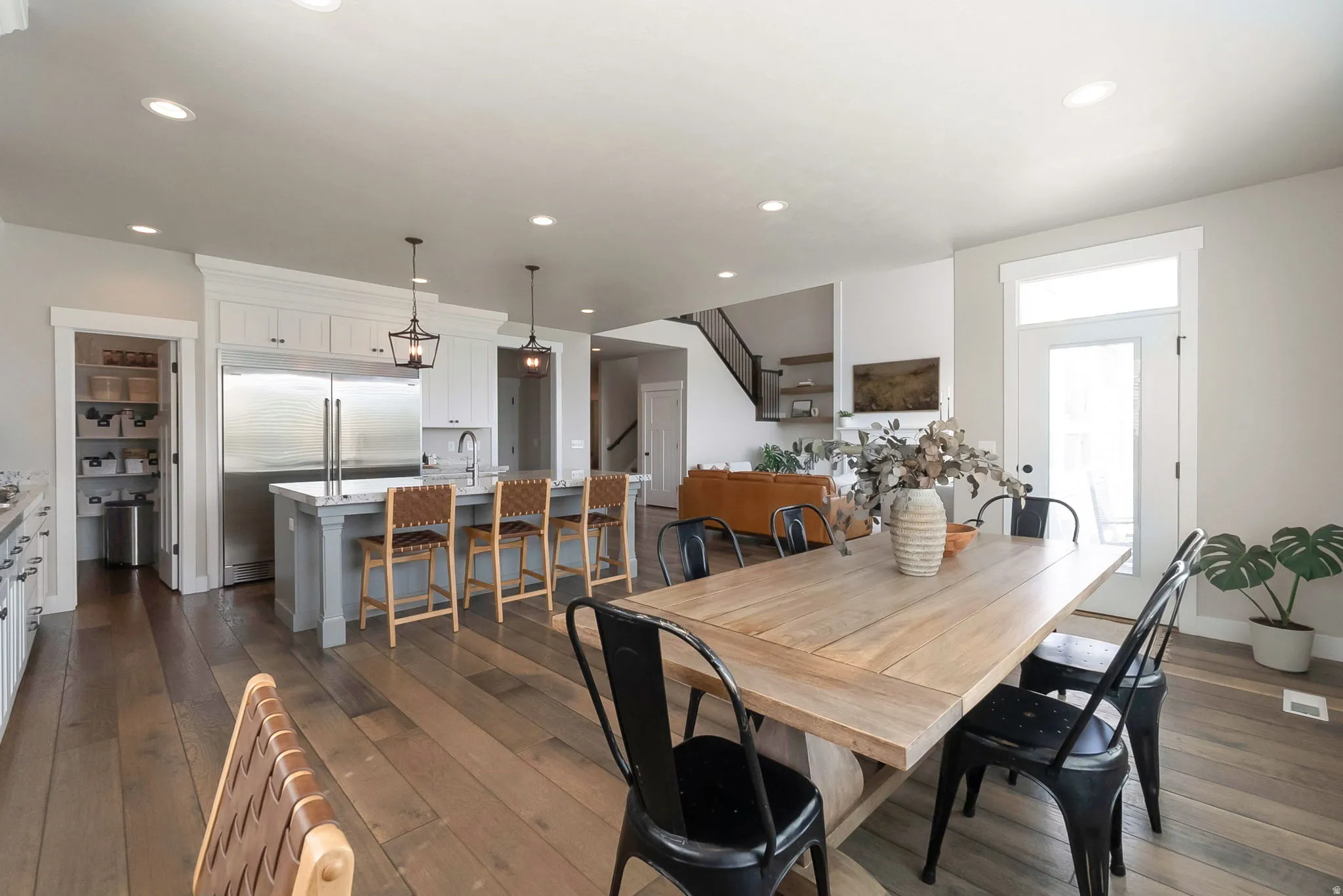 Dining space featuring dark wood finished floors and recessed lighting