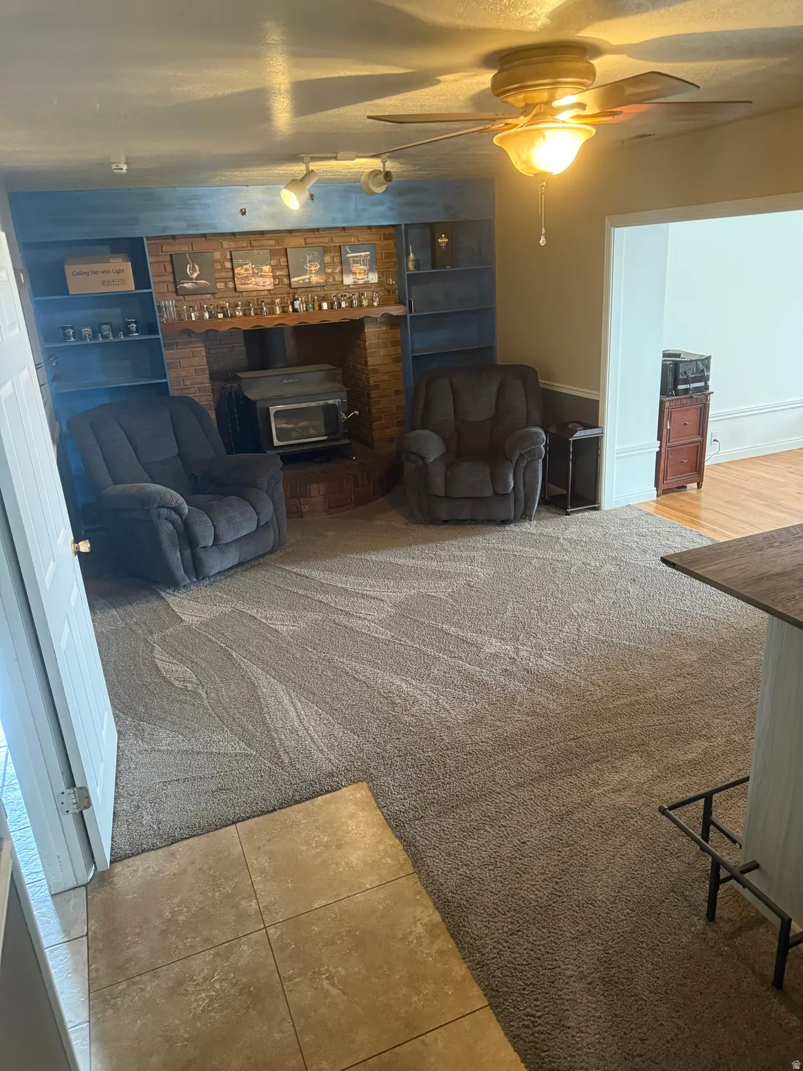 Den area with Wood burning fireplace