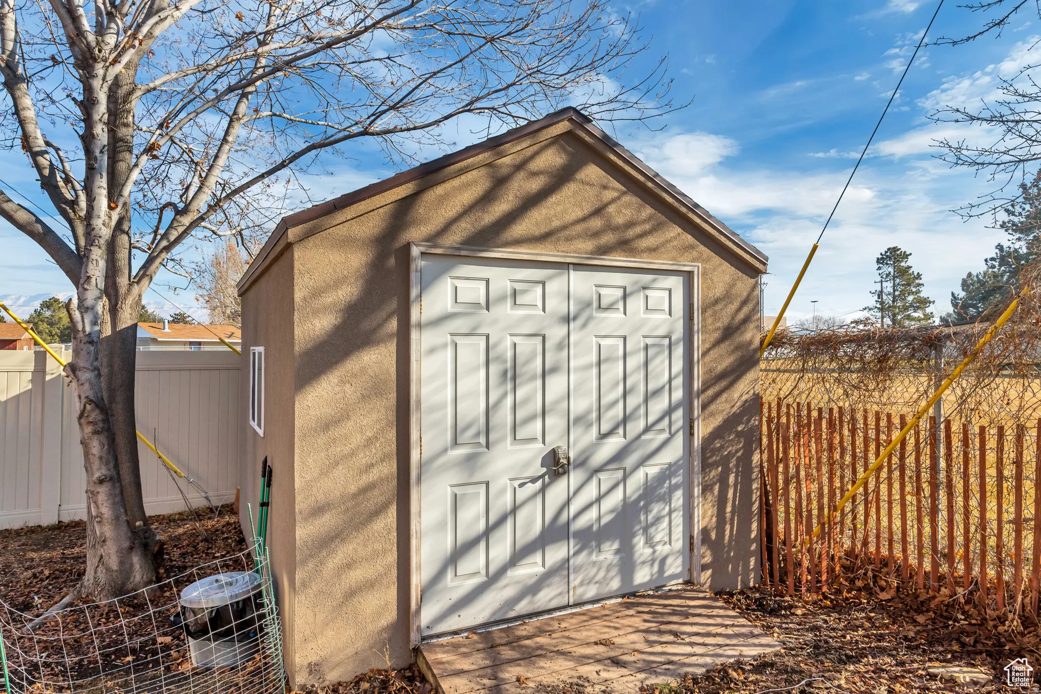 View of shed with a fenced backyard