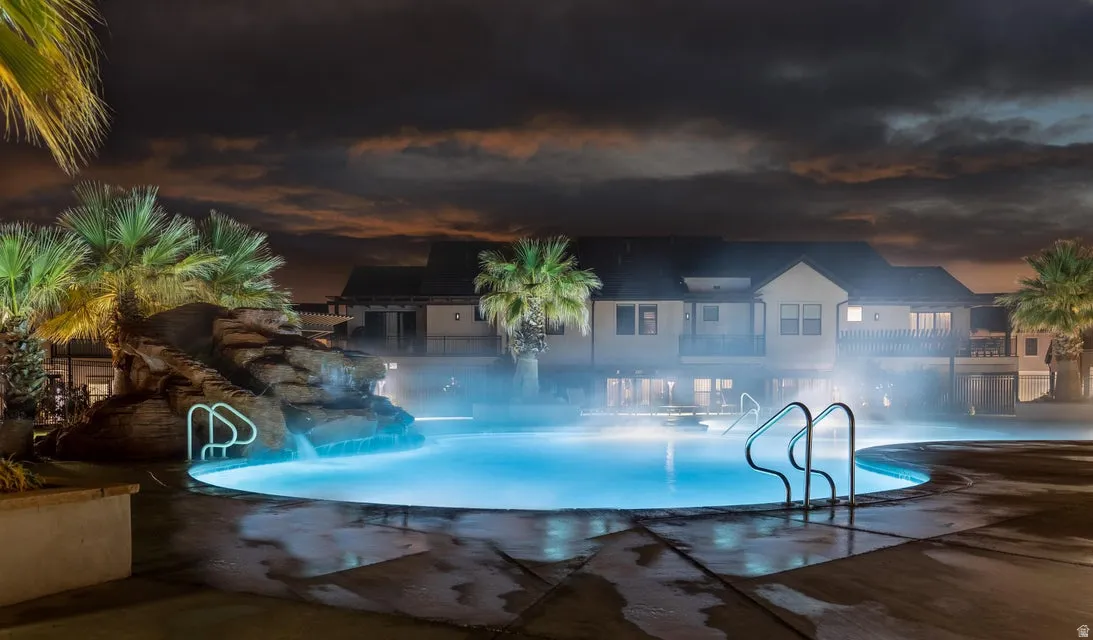 Community pool with a patio