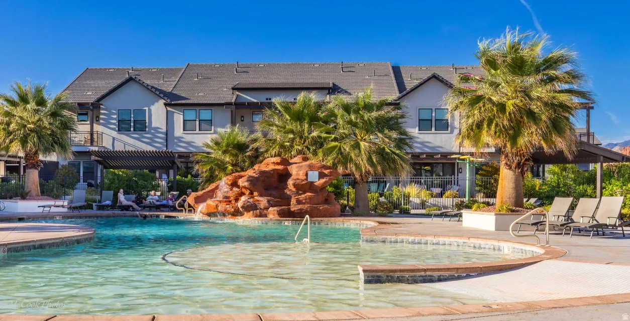 Community pool with a patio and a pergola
