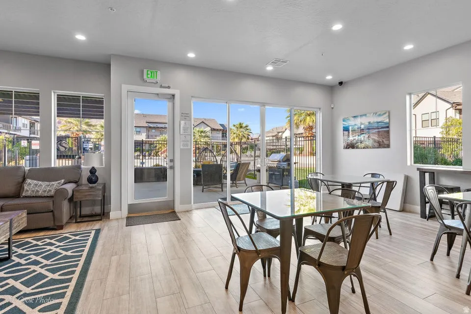 Dining space with light wood-type flooring and recessed lighting