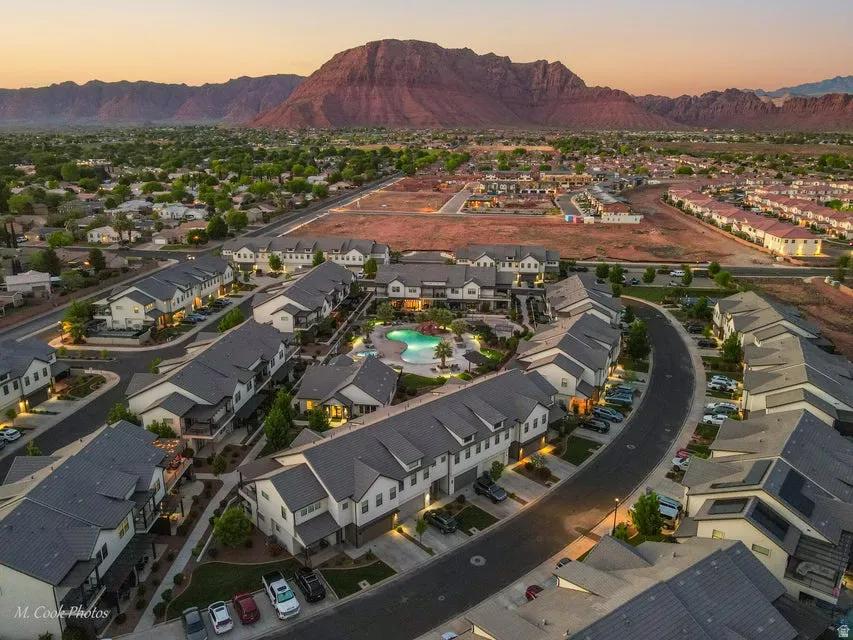 Aerial perspective of suburban area featuring a mountainous background