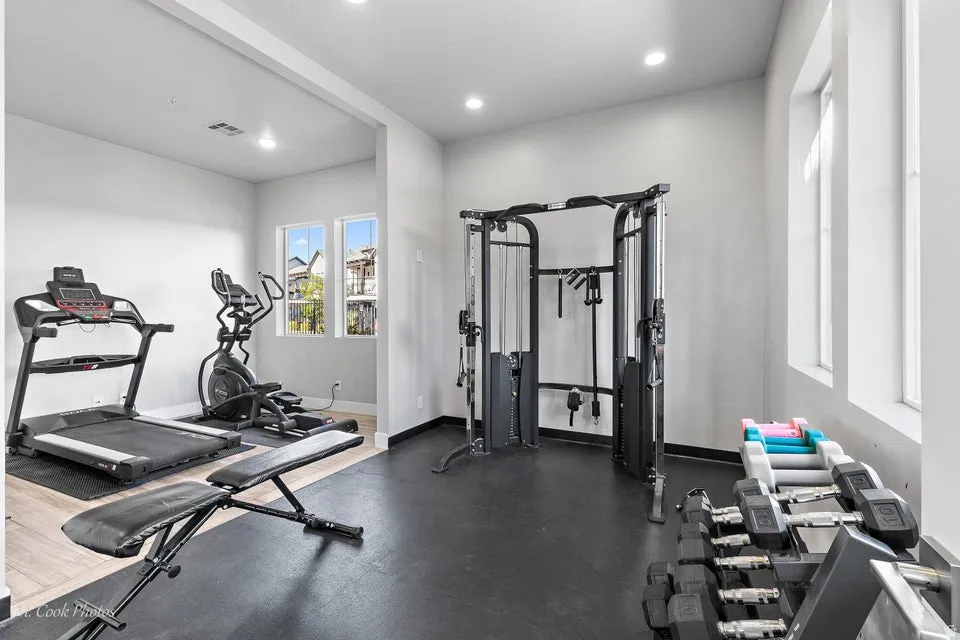 Workout area featuring recessed lighting
