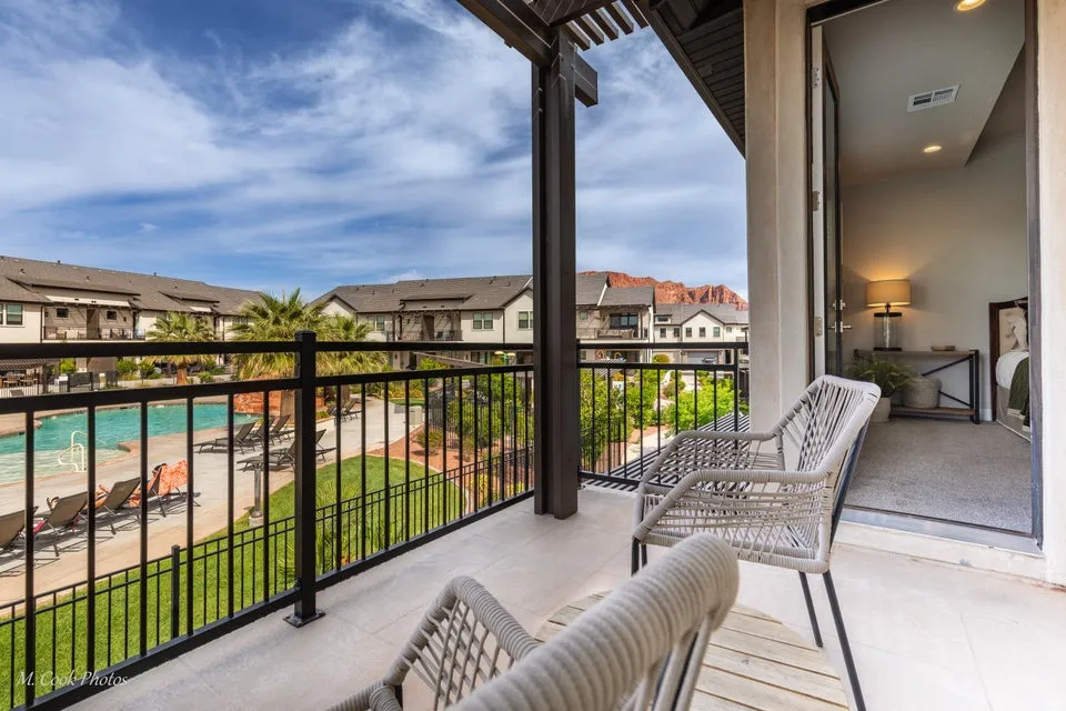 Balcony featuring a residential view and view of pool area
