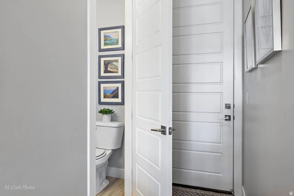 Doorway to outside with wood finished floors