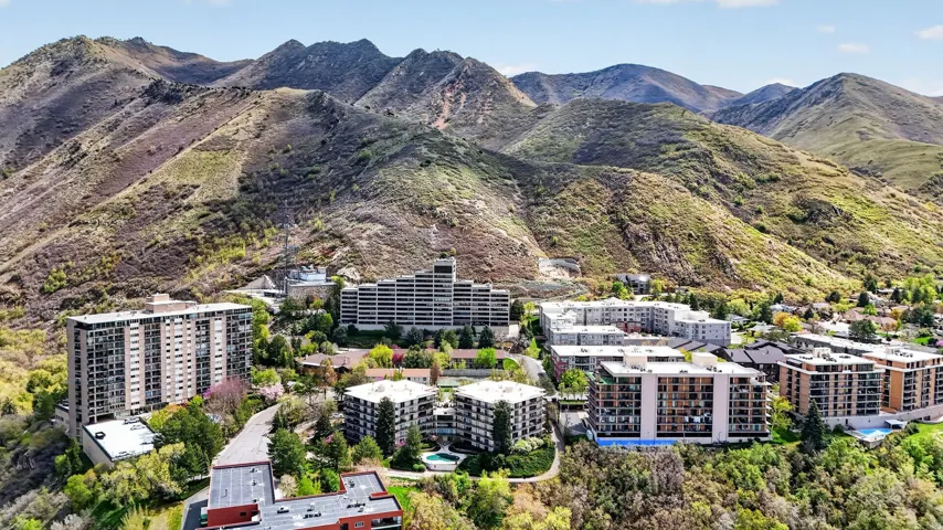 Drone / aerial view of mountains and apartment complex
