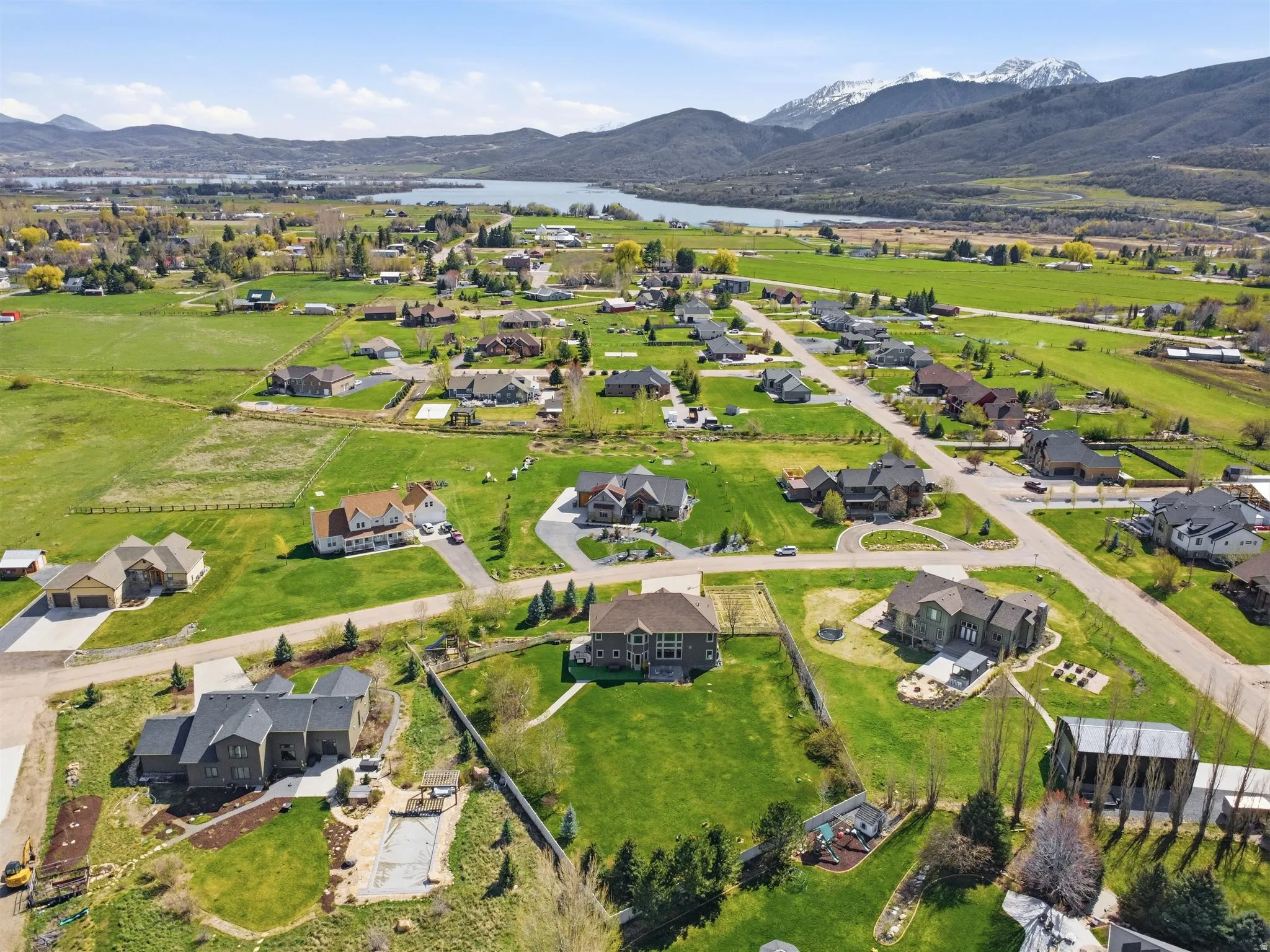 View of property location with a water and mountain view and nearby suburban area
