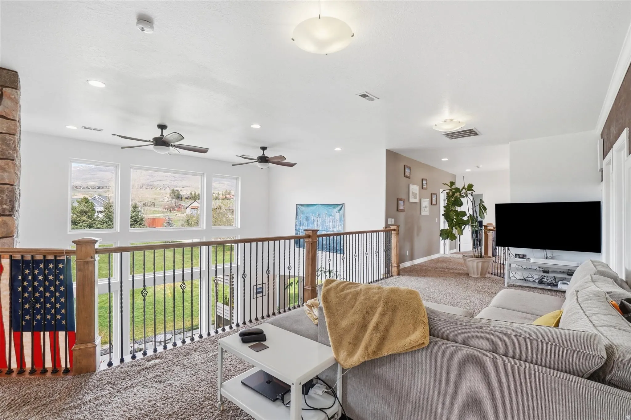 Carpeted living area featuring recessed lighting