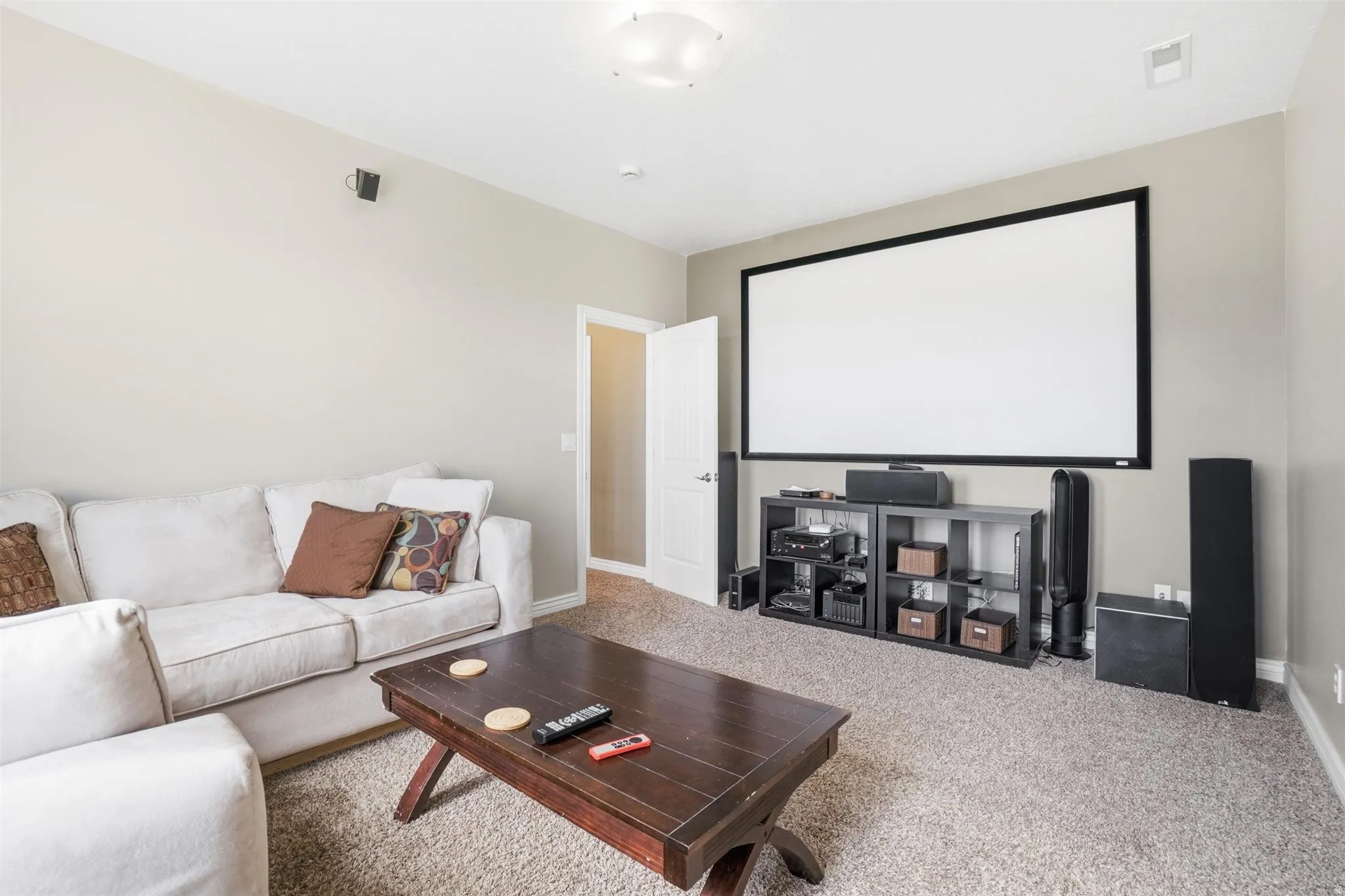 Cinema with carpet floors and baseboards
