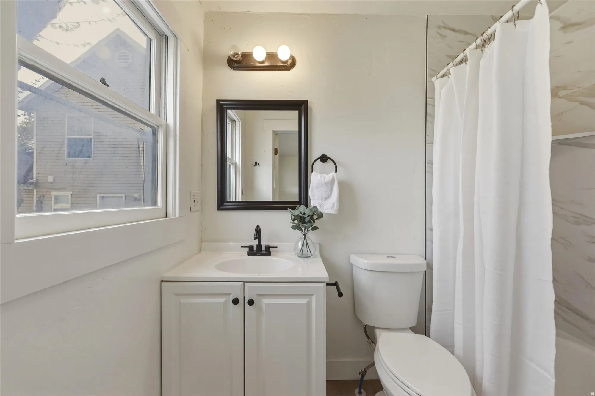 Full bathroom featuring vanity and shower / tub combo