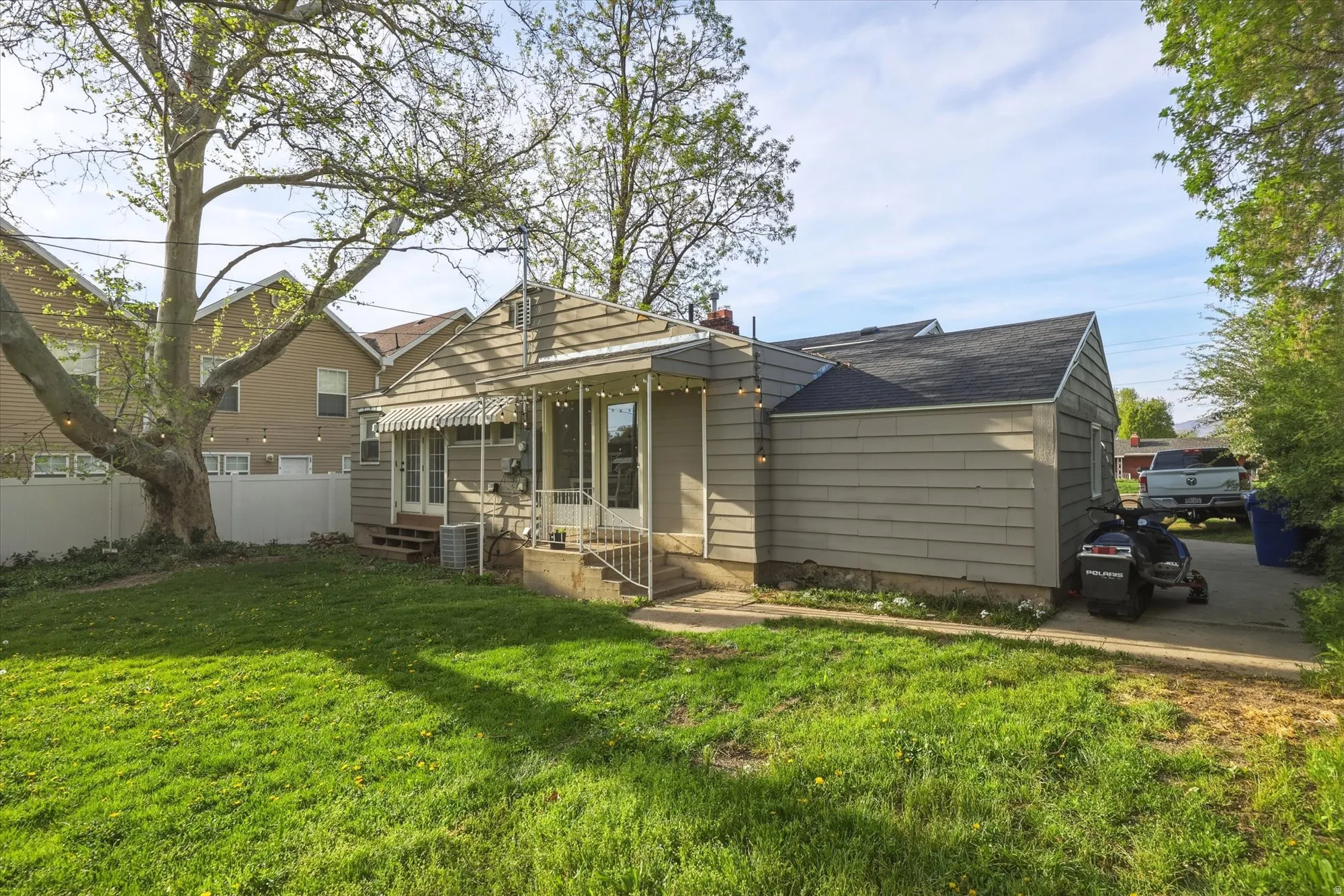 Rear view of property with roof with shingles