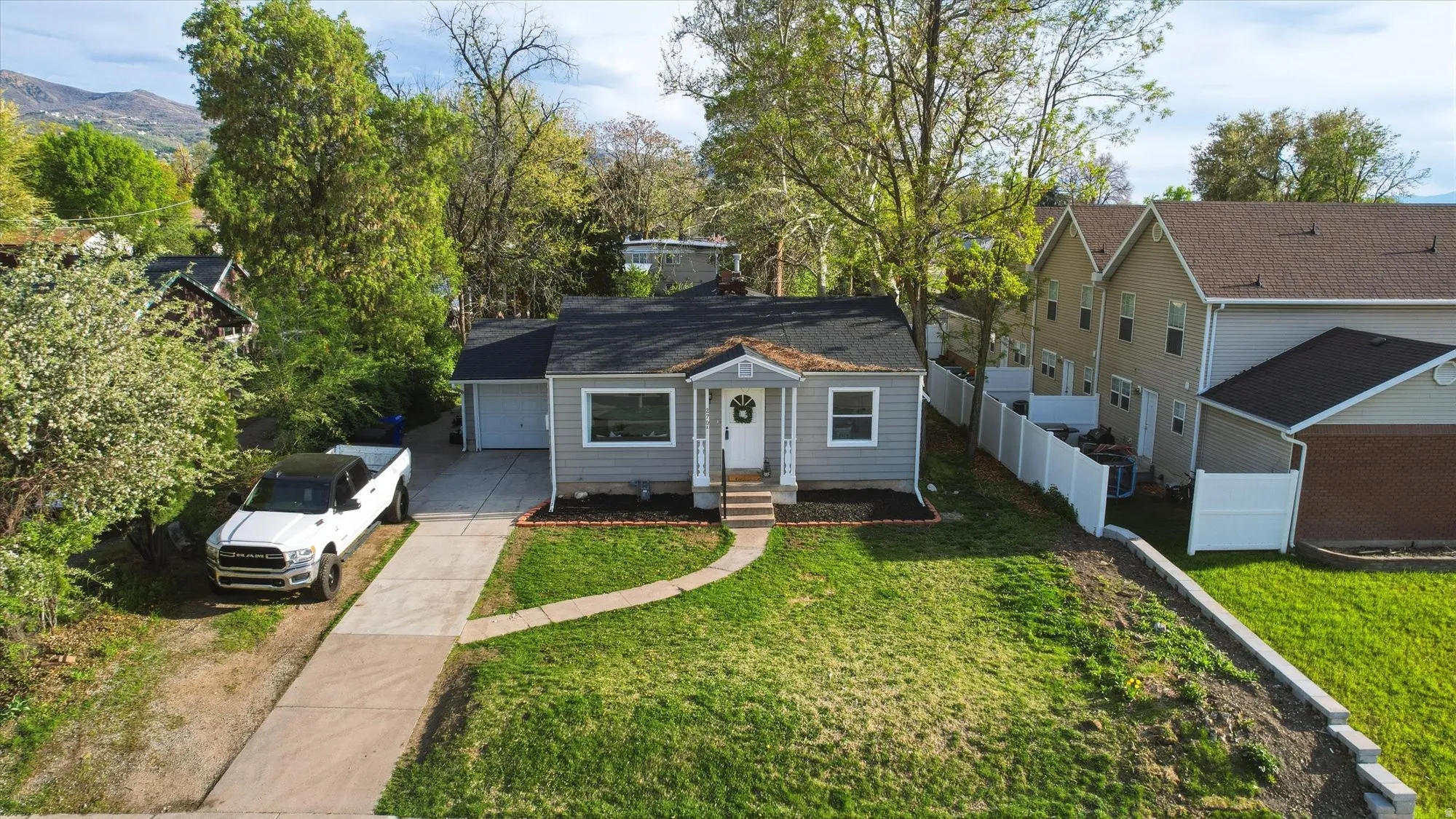 Bungalow-style house with driveway and a garage