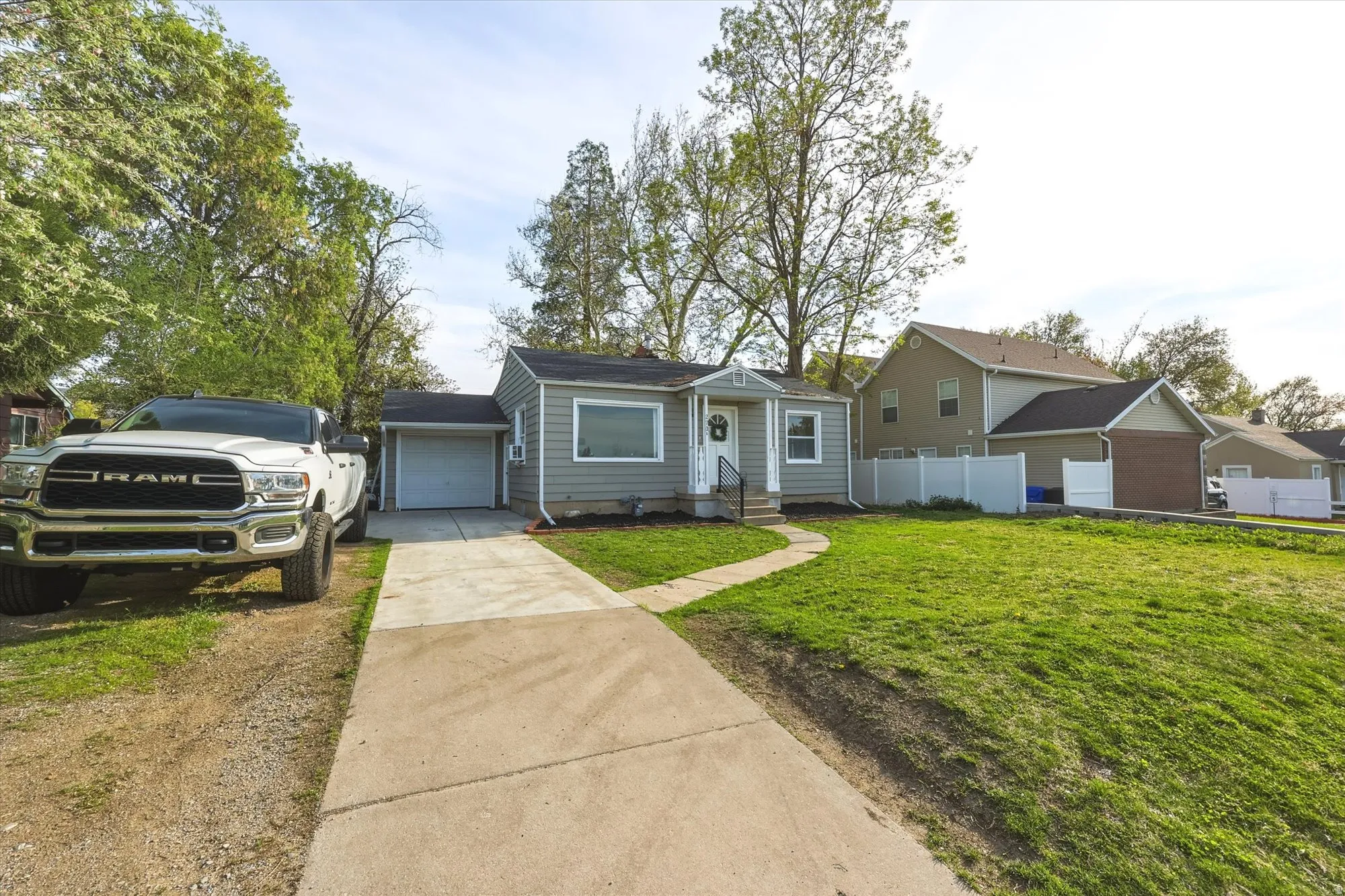 View of front of house featuring concrete driveway