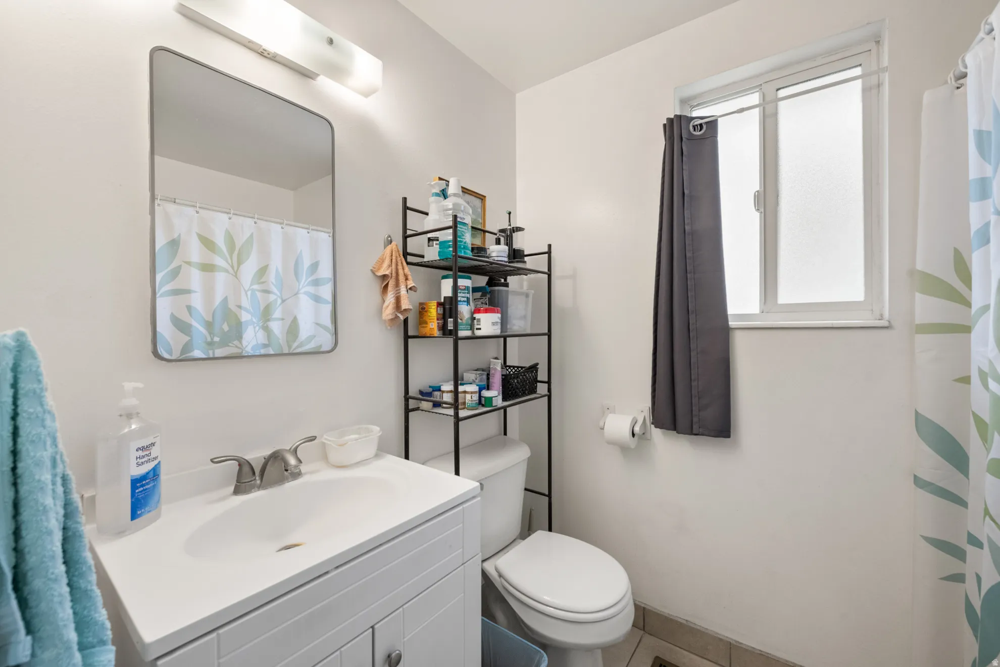 Full bathroom with vanity and curtained shower