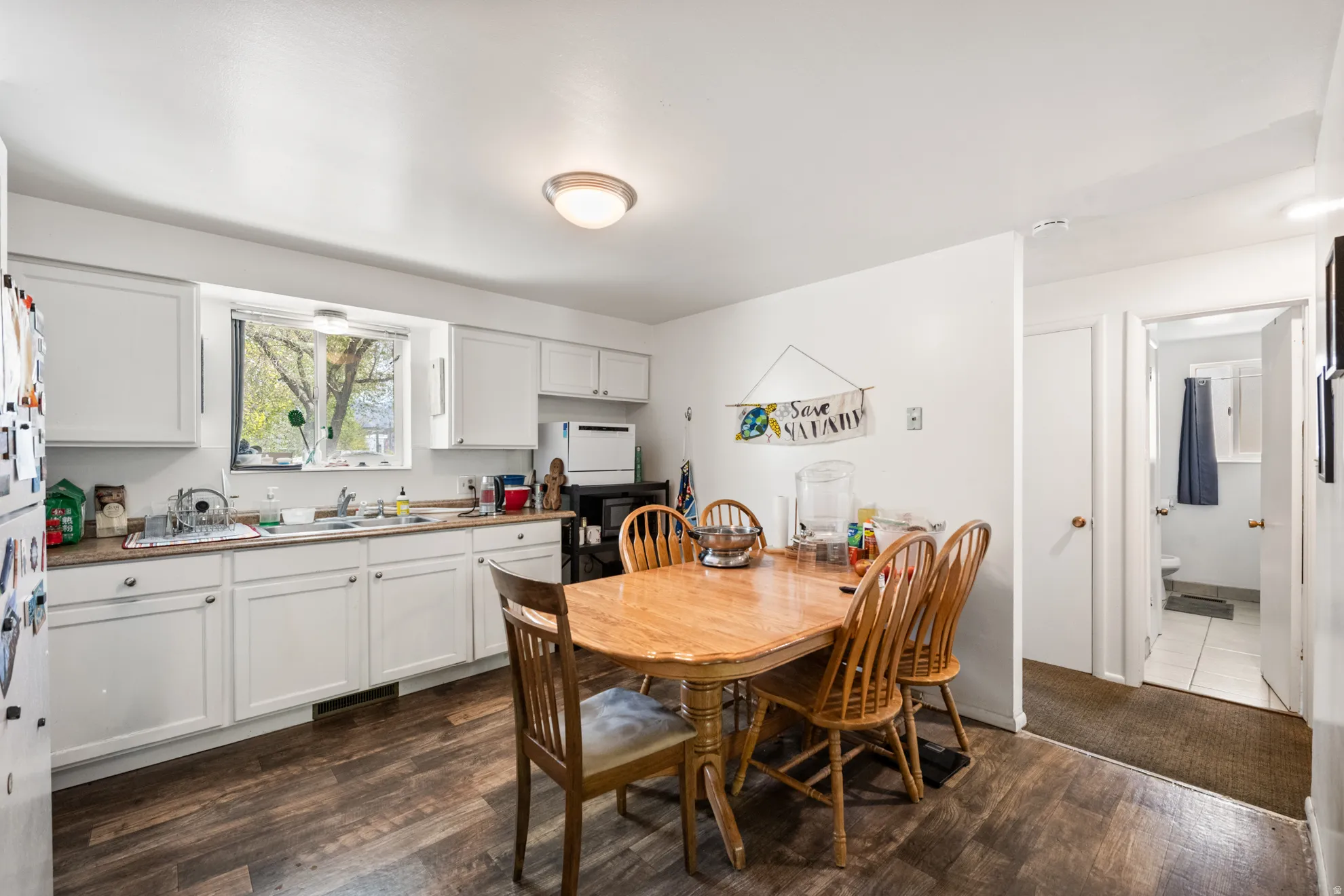 Dining space featuring dark wood finished floors