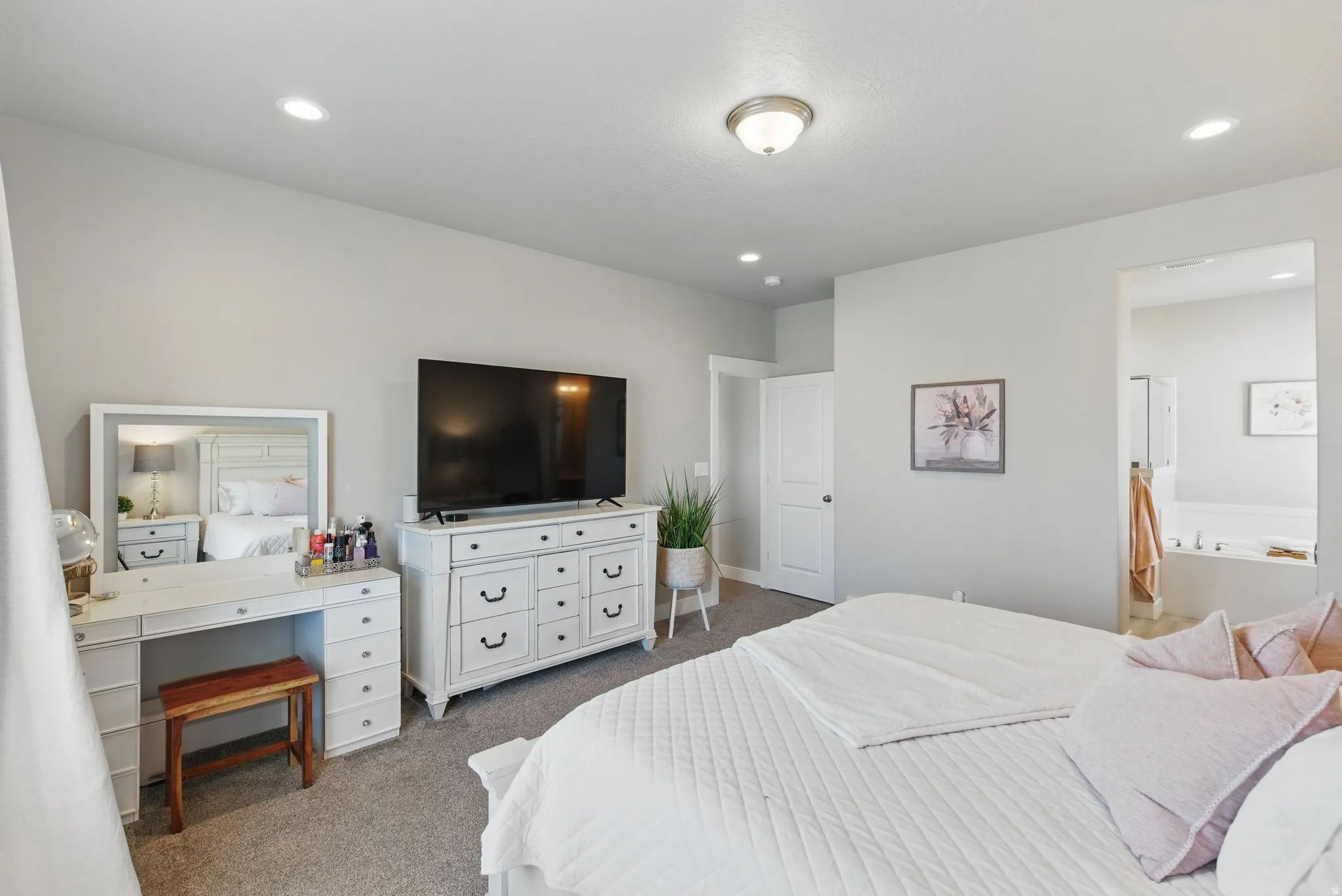 Bedroom featuring light colored carpet and recessed lighting