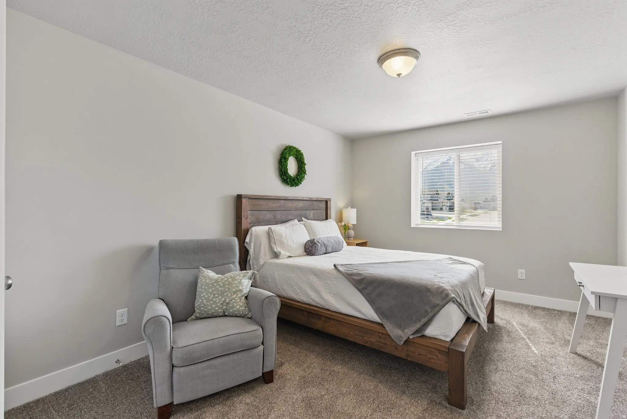Bedroom with carpet flooring and a textured ceiling