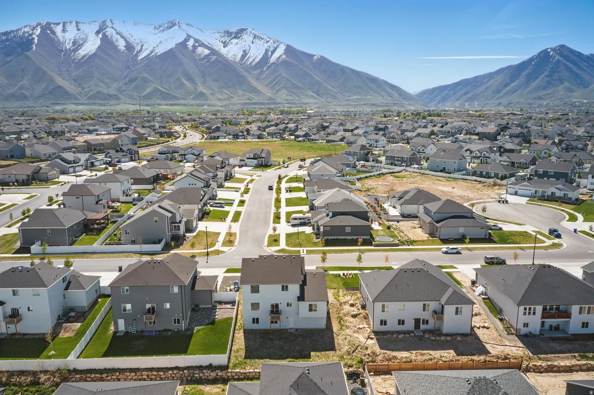 Aerial perspective of suburban area featuring a mountain backdrop