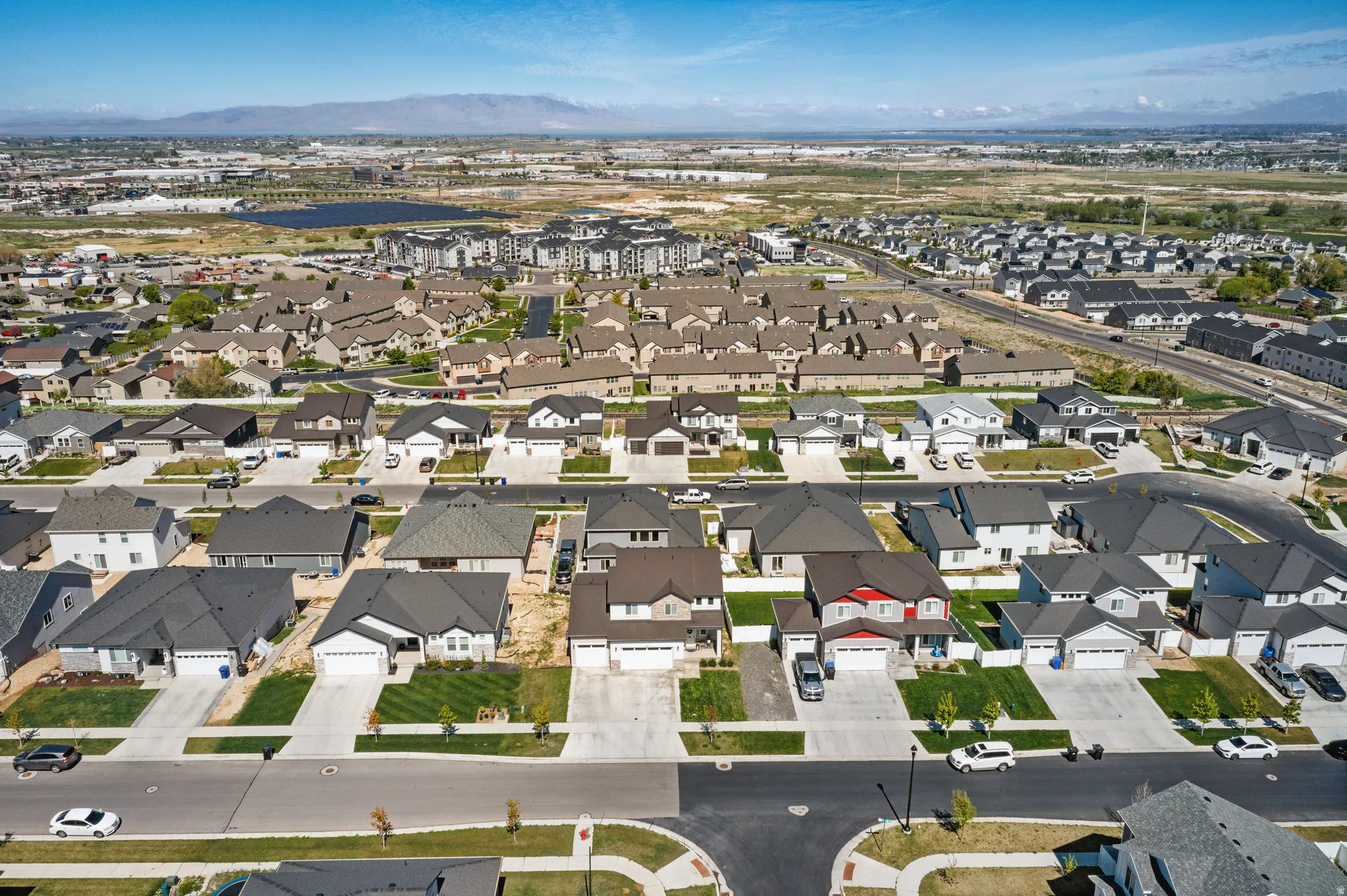 Aerial view of property's location featuring mountains and nearby suburban area