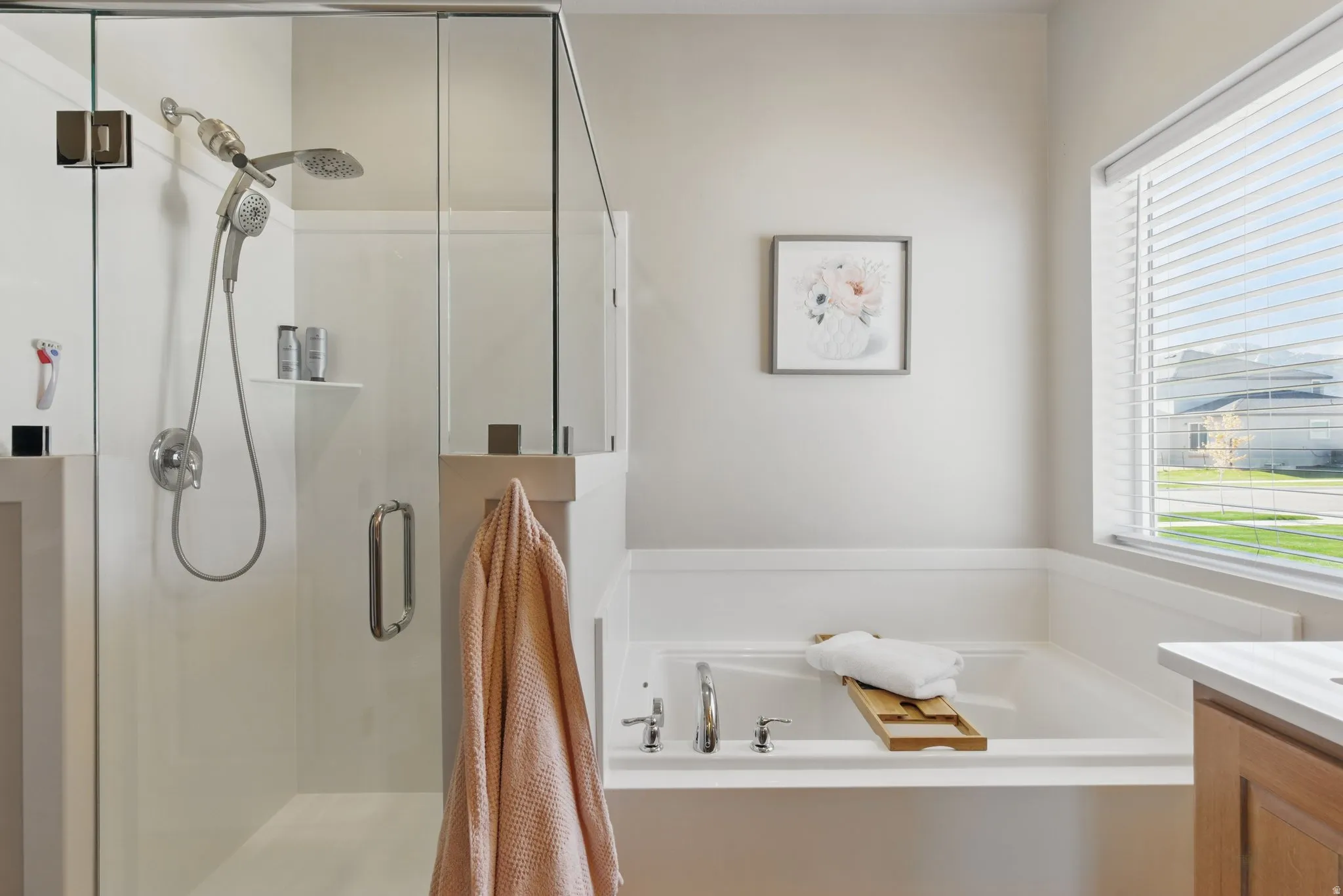 Full bathroom with a bath, vanity, and a shower stall
