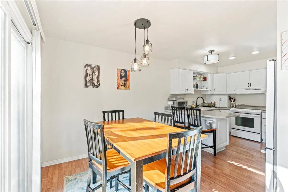 Dining room featuring light wood-style flooring and baseboards