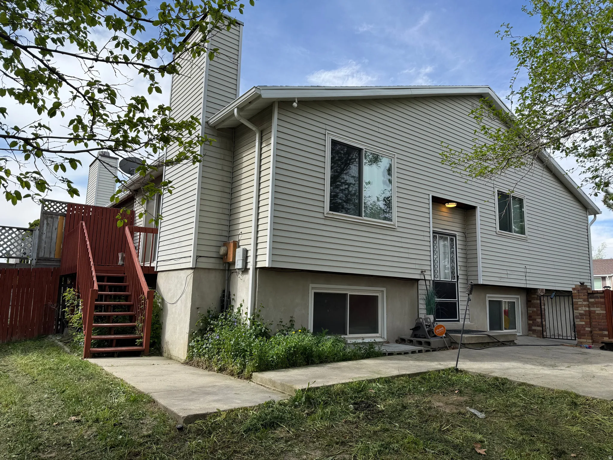 Rear view of house featuring stairway