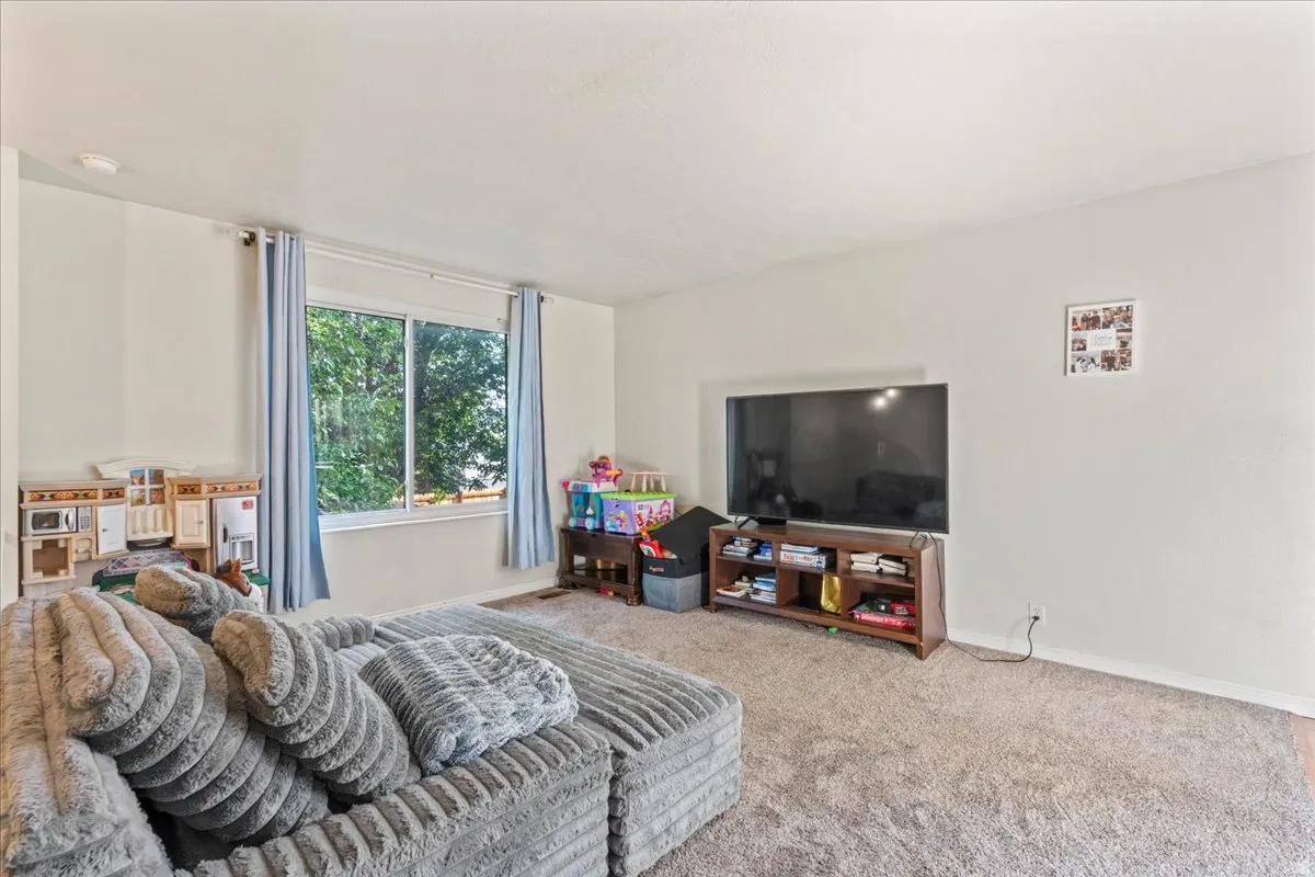Carpeted bedroom with baseboards