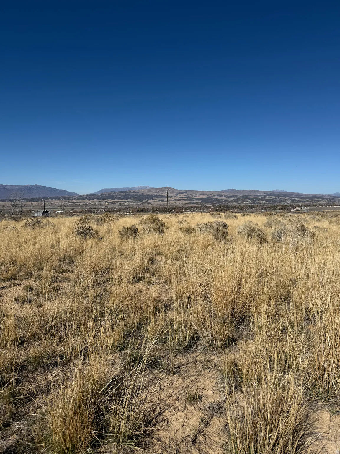 View of mountain background featuring rural landscape