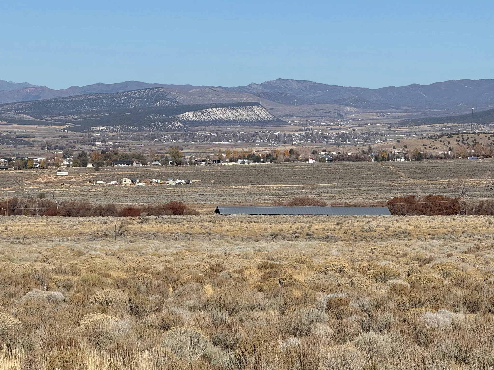 View of mountain backdrop with rural landscape