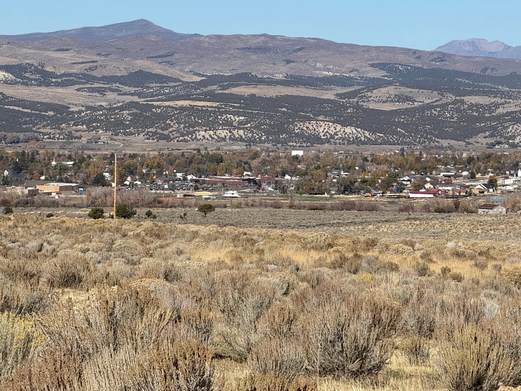 View of mountain background featuring rural landscape