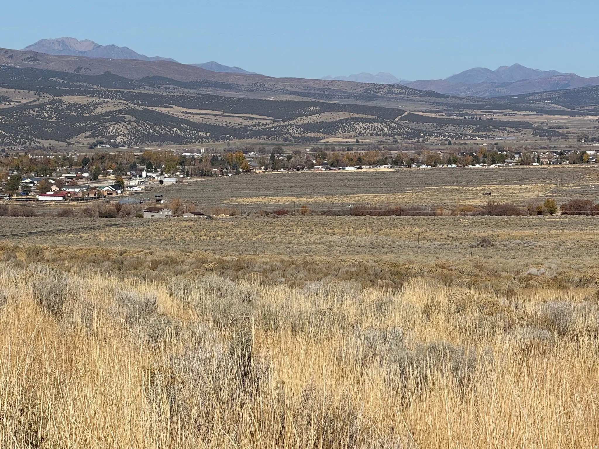 View of mountain background featuring rural landscape