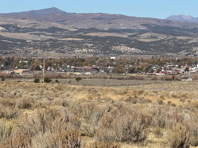 View of mountain background featuring rural landscape