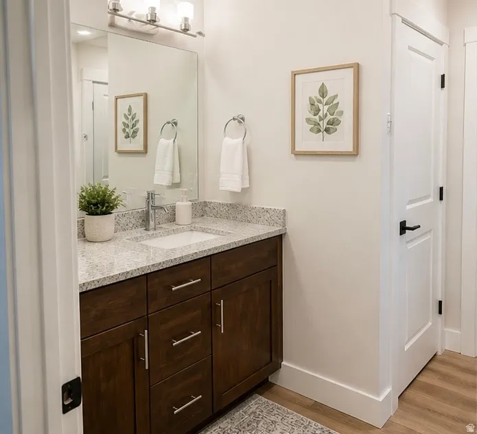 Bathroom featuring vanity and light wood-type flooring