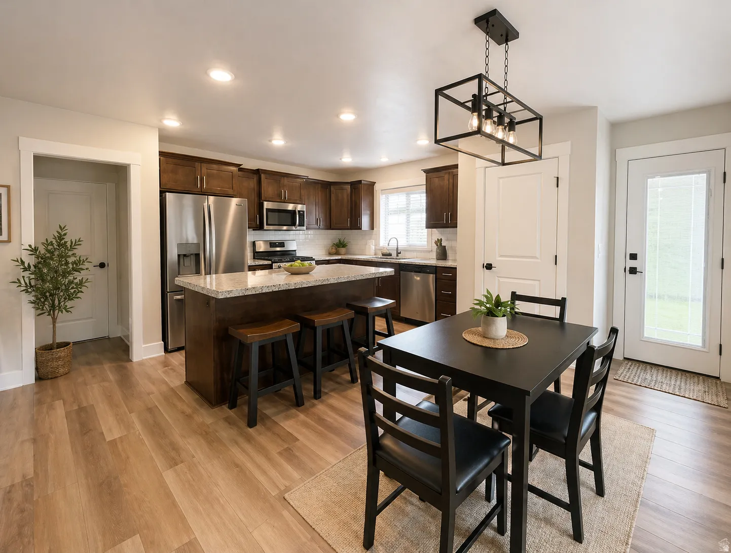 Dining room featuring light wood-type flooring and hanging lights