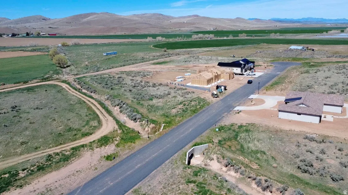 Aerial view of property's location with mountains and rural landscape