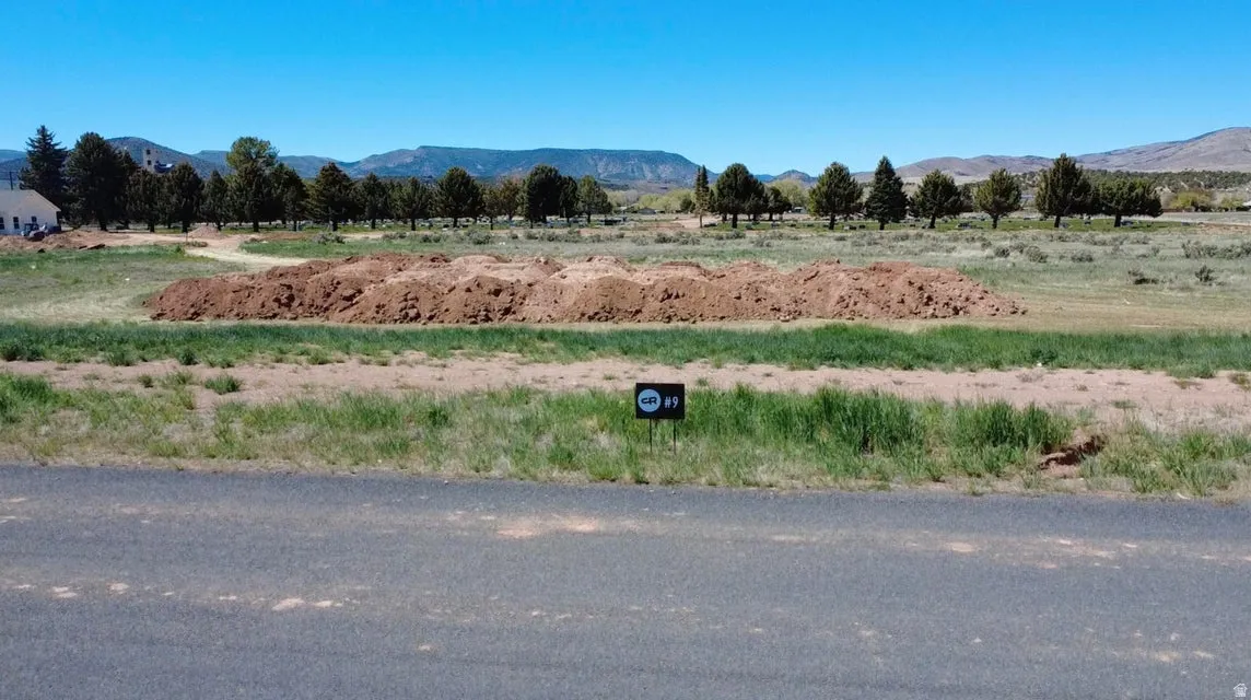 View of mountain background featuring rural landscape