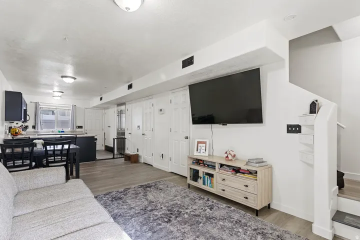 Living area with wood finished floors and baseboards