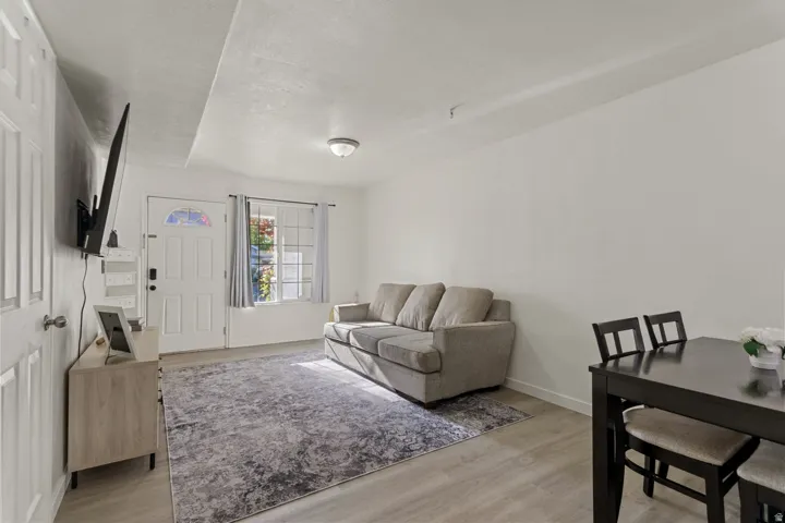 Living area featuring light wood-style floors and baseboards