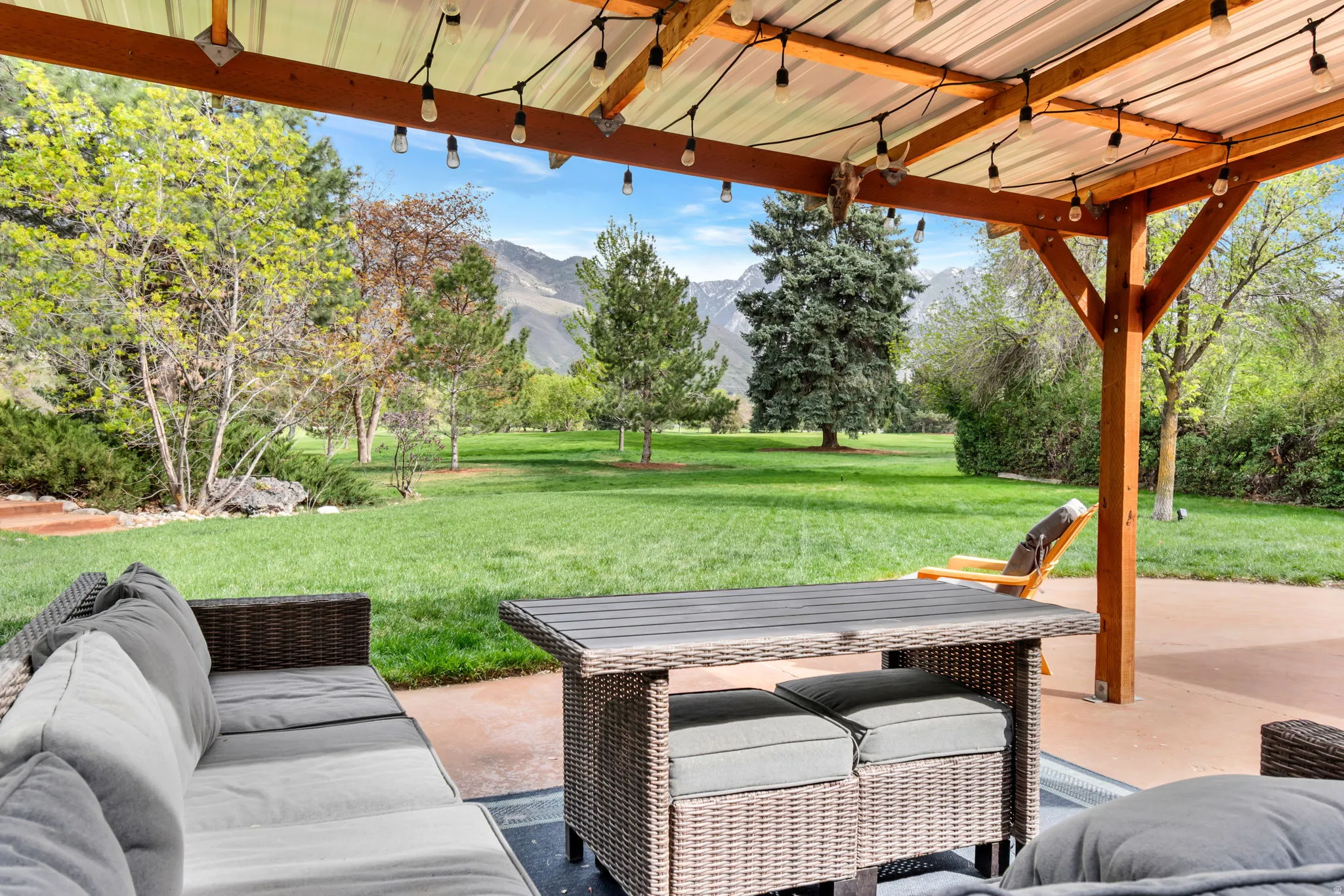 View of patio featuring a mountain view and an outdoor living space