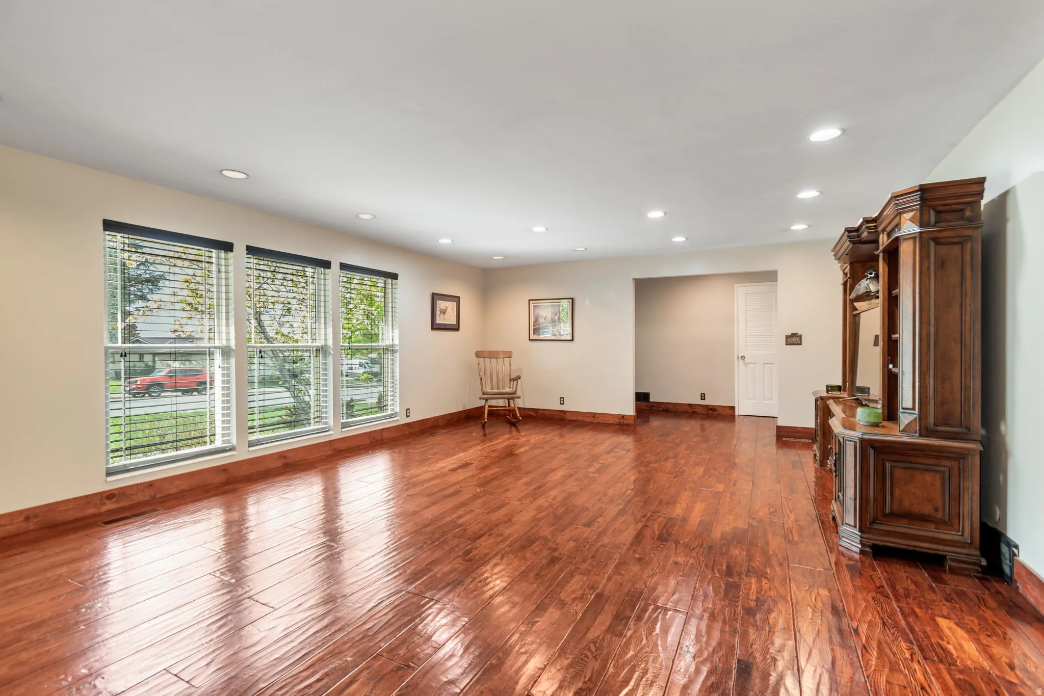 Spare room with dark wood finished floors and recessed lighting
