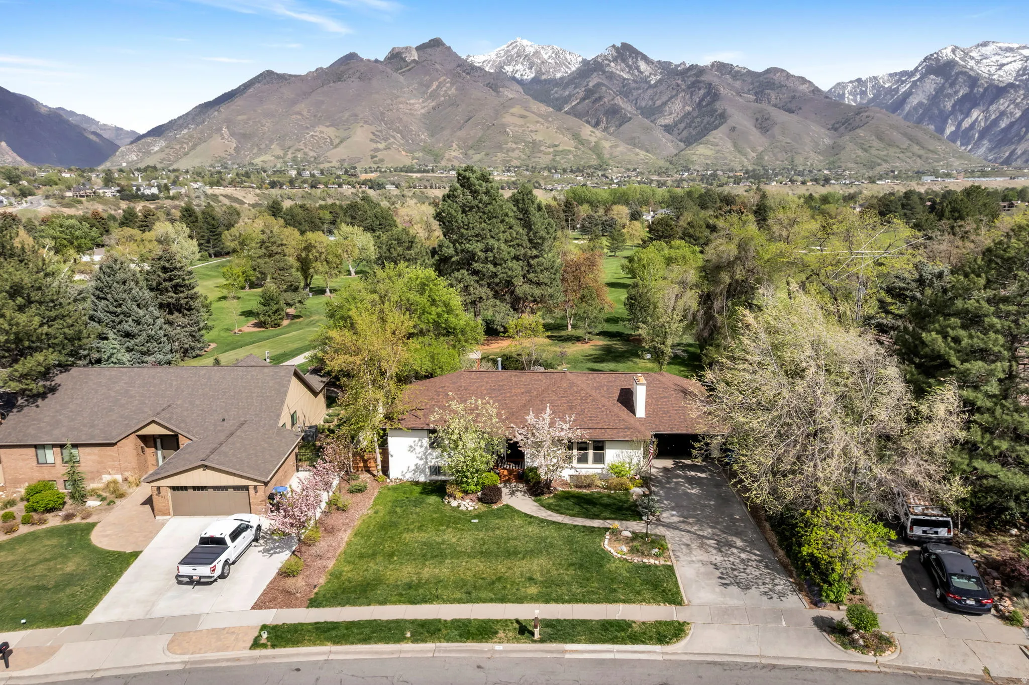 View of subject property with a mountain backdrop